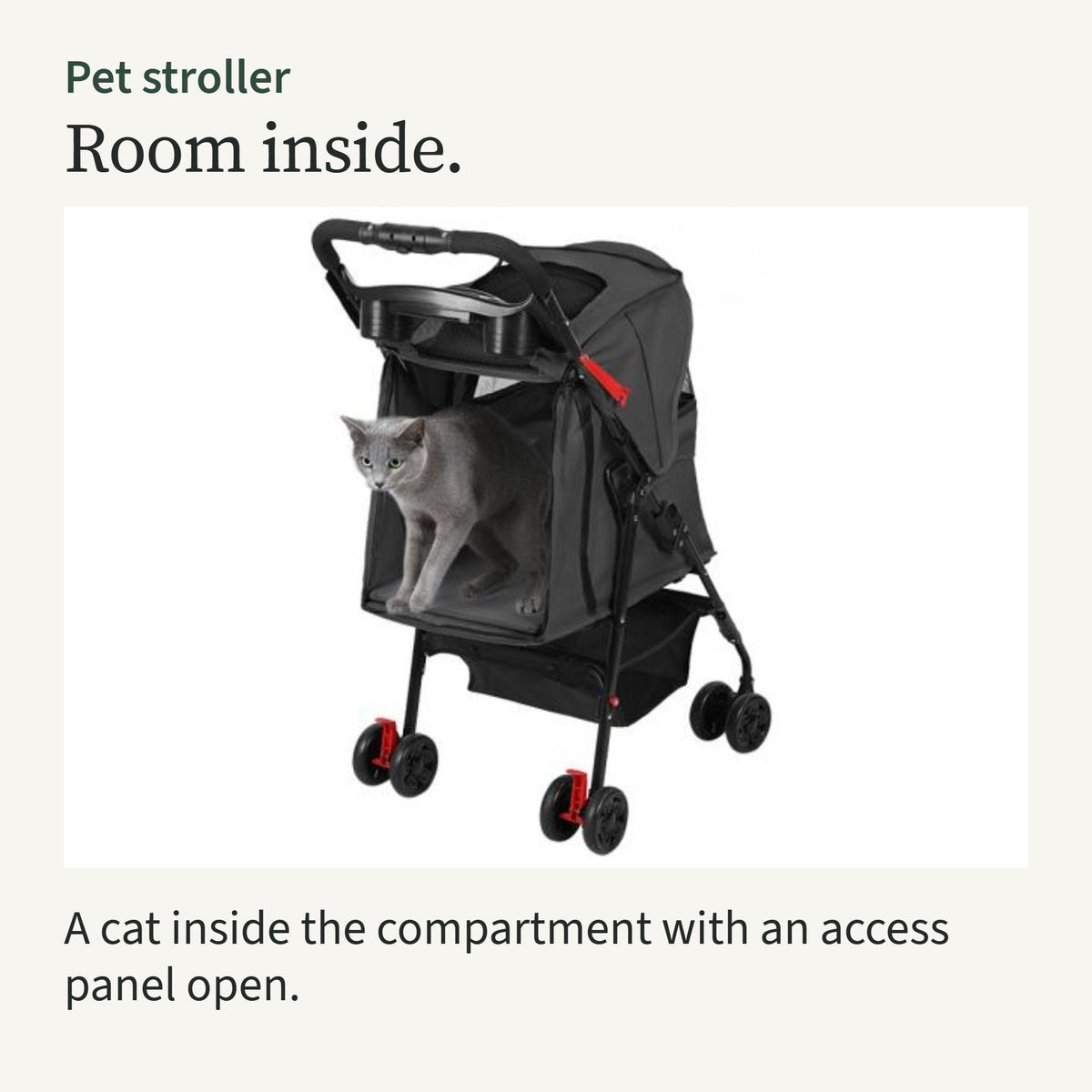 A grey cat standing inside the black stroller compartment with an access panel open