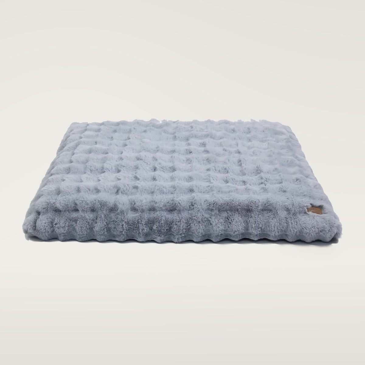 Dusty Blue plush faux-fur dog mattress with a small brown BingoPaw tag