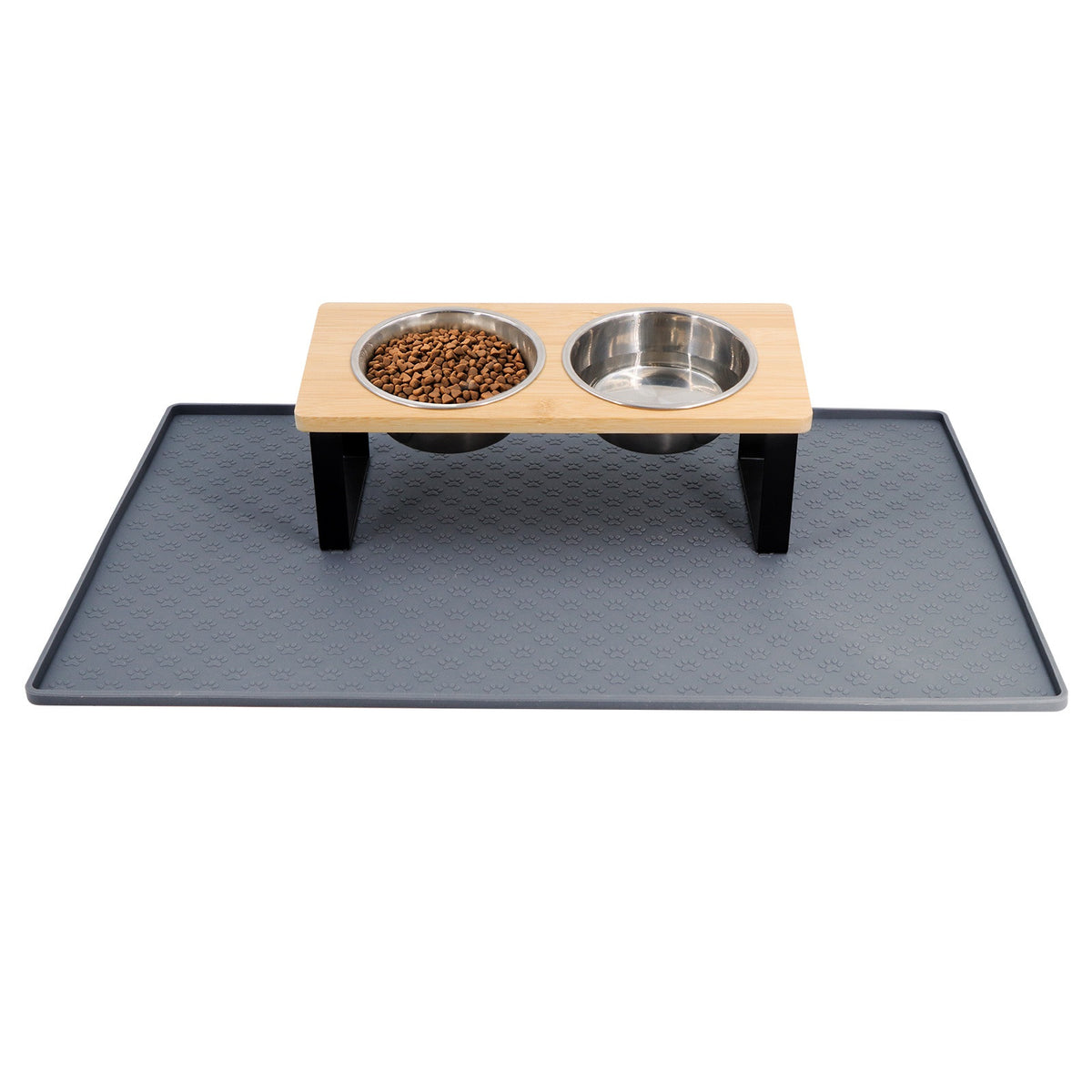 Raised bamboo feeding stand with two stainless bowls standing on a grey silicone mat