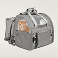 Grey mesh-window pet carrier backpack with its side extension open and a kitten inside