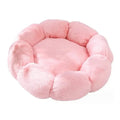 Round pink plush cat bed with a ring of puffy petal-shaped lobes