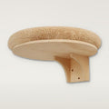 Round plush cat bed on a pine wall bracket