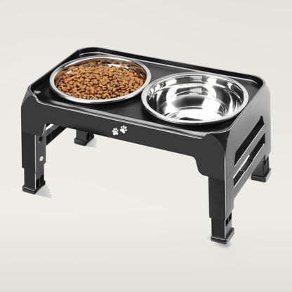 Black raised dog feeder stand with two stainless steel bowls, one filled with kibble