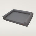 Grey faux-leather dog bed with bolsters on three sides and a small brown BingoPaw label