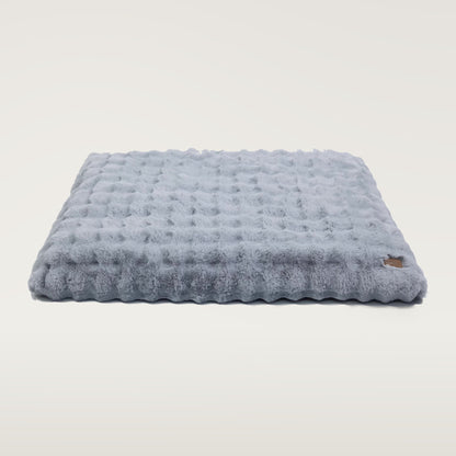 Dusty Blue plush faux-fur dog mattress with a small brown BingoPaw tag