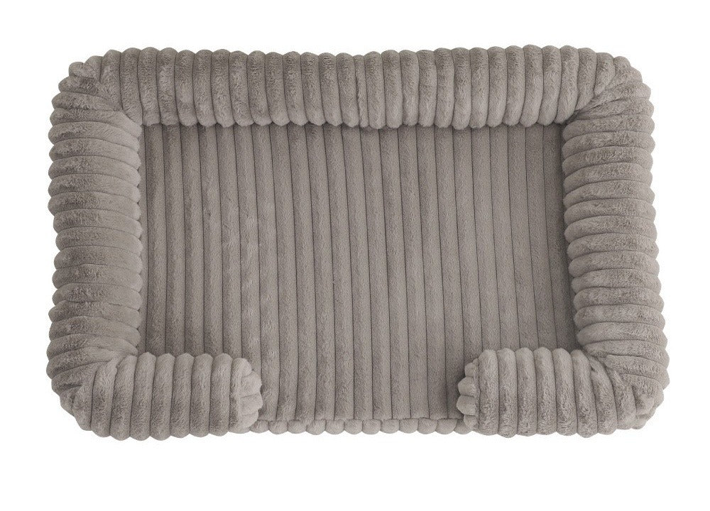 Greyish-taupe ribbed plush dog bed with bolsters and rounded front ends, seen from above on white