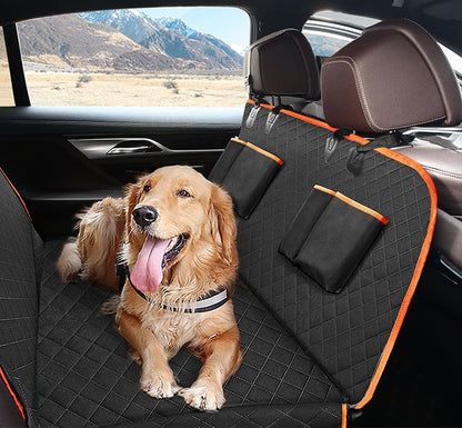 A golden retriever lying on the orange-trimmed quilted cover, two pockets on the backrest