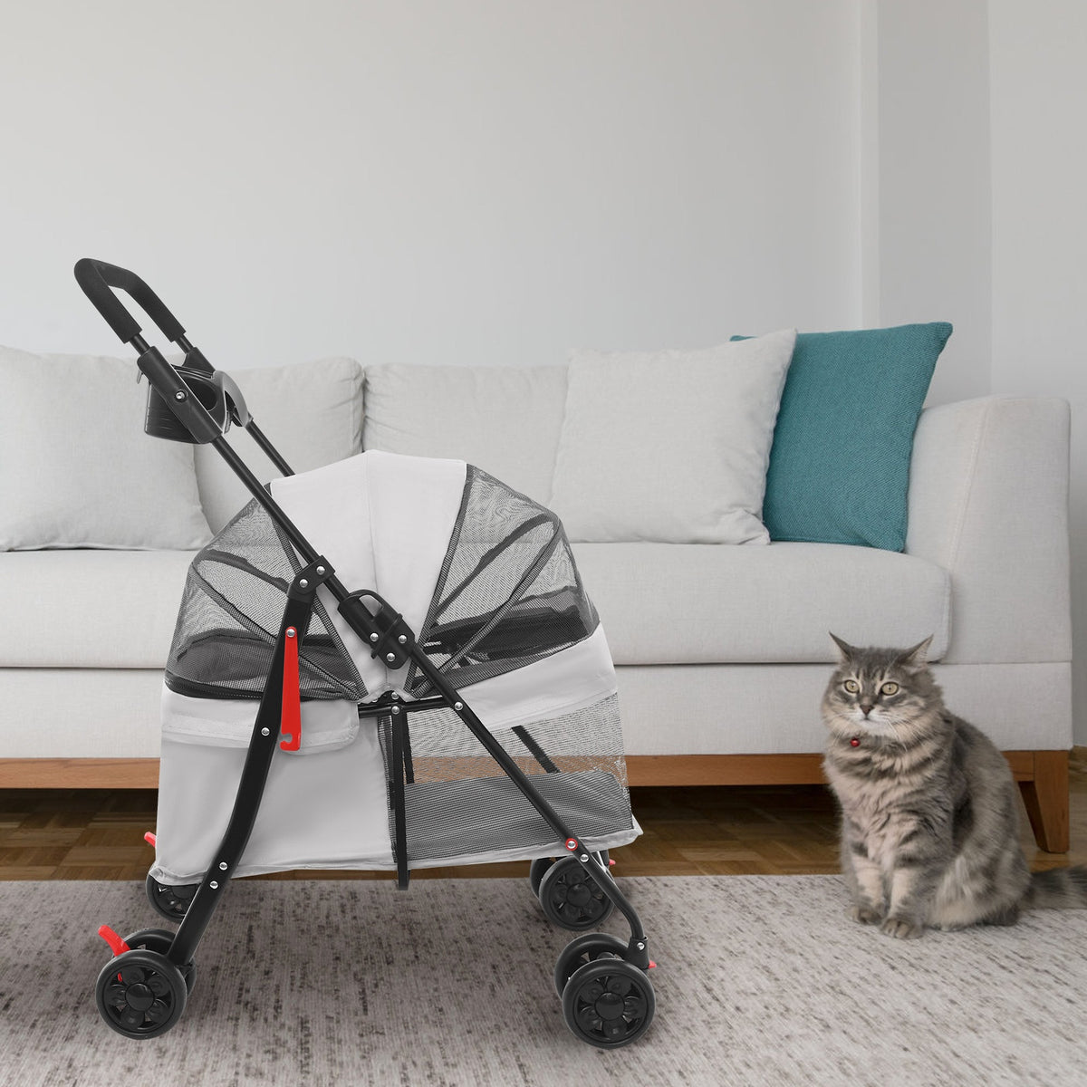 Grey pet stroller in a living room with a tabby cat sitting beside it