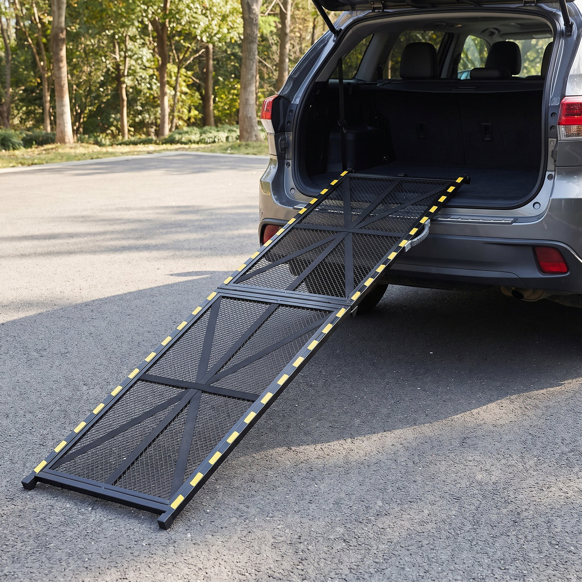 Folding dog ramp, 20 in version, resting on the cargo floor of a parked SUV