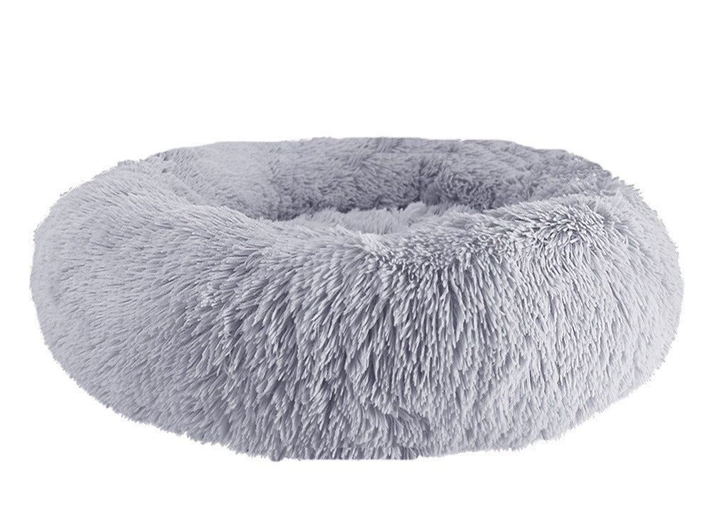 Light gray long-pile faux-fur donut bed with a raised rim, on a white background