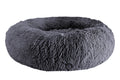 Dark gray long-pile faux-fur donut bed with a raised rim, on a white background