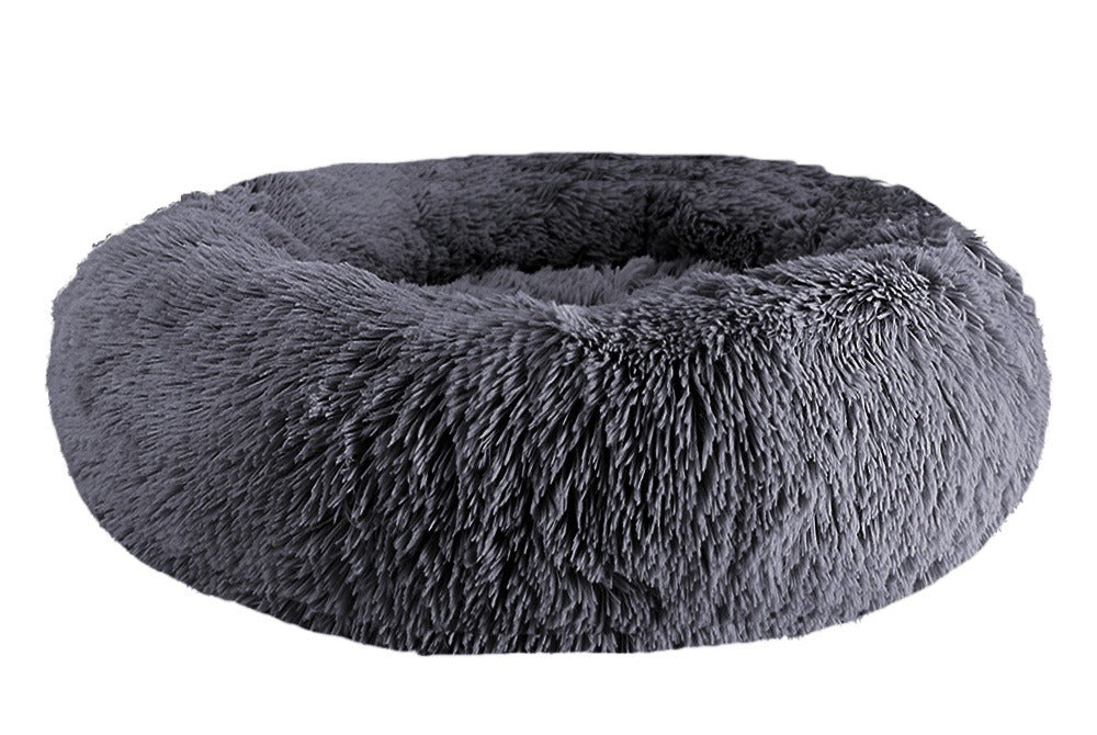 Dark gray long-pile faux-fur donut bed with a raised rim, on a white background