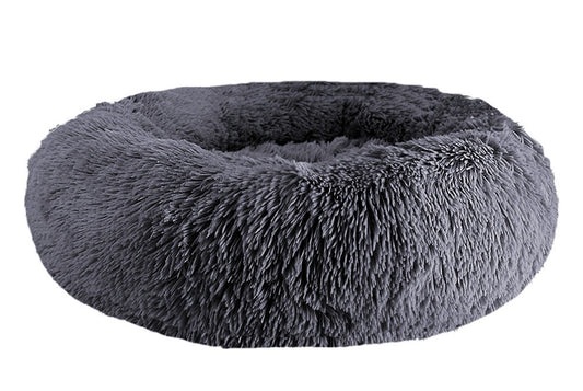 Dark gray long-pile faux-fur donut bed with a raised rim, on a white background