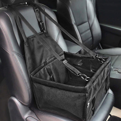 Black hanging dog booster seat strapped to a car front seat
