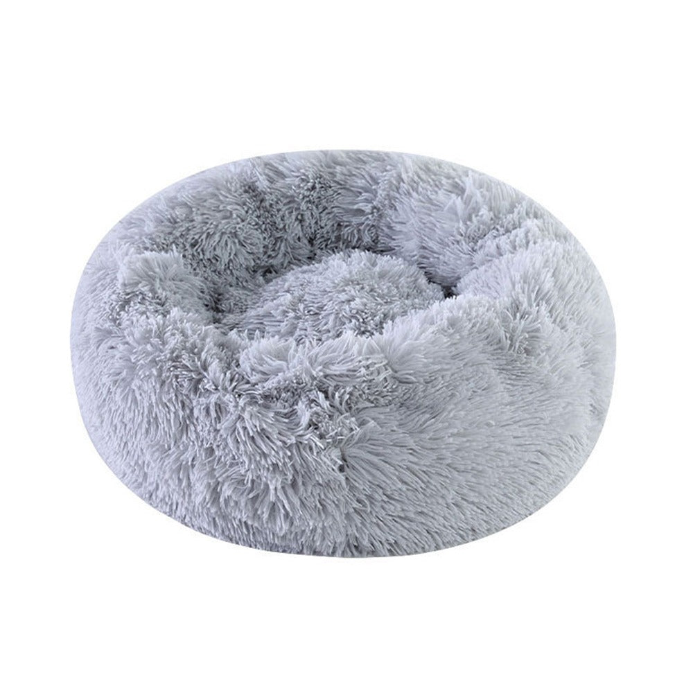 Grey long-pile shag donut bed on its own on a white background