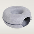 Light gray round felt cat tunnel bed with a side opening and a zip around the middle