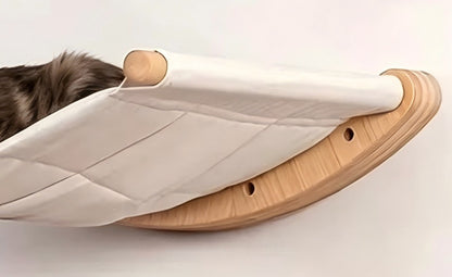 Close-up of the canvas hammock with its curved wooden side board and round end bar