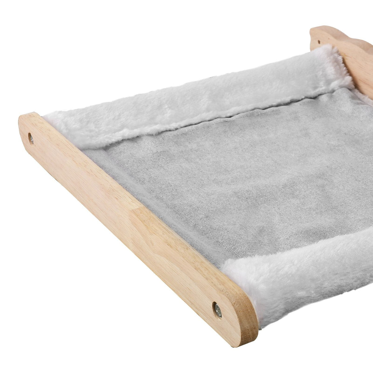 Close-up of a hammock shelf: light-grey fabric with white plush ends between natural wood rails
